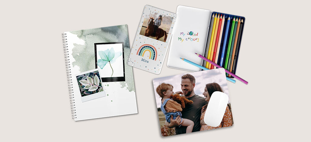 Produits créatifs colorés de CEWE comme un carnet, des cartes postales et des stylos