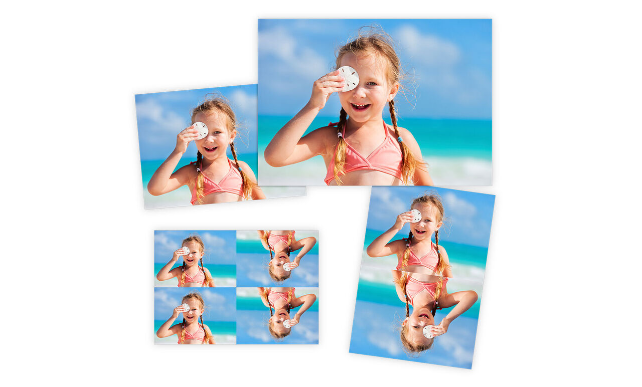 Un enfant joyeux avec des lunettes de soleil sur la plage sous un ciel bleu.