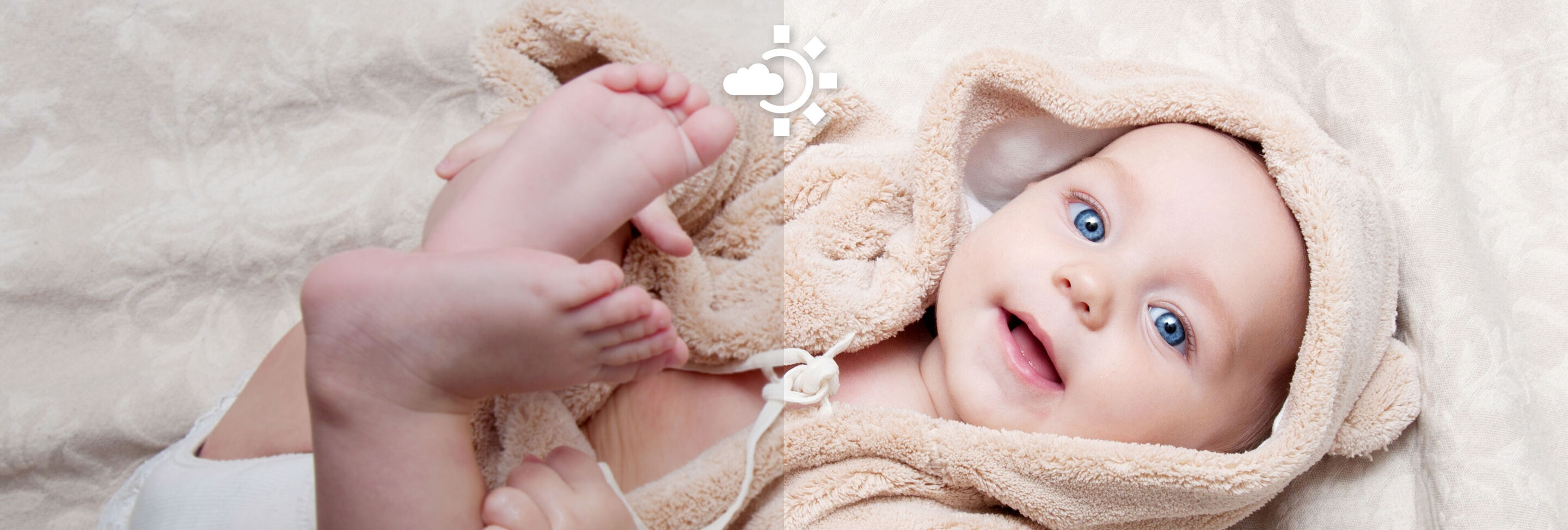 Un bébé dormant sur une douce couverture, emmitouflé dans une serviette douce et beige.