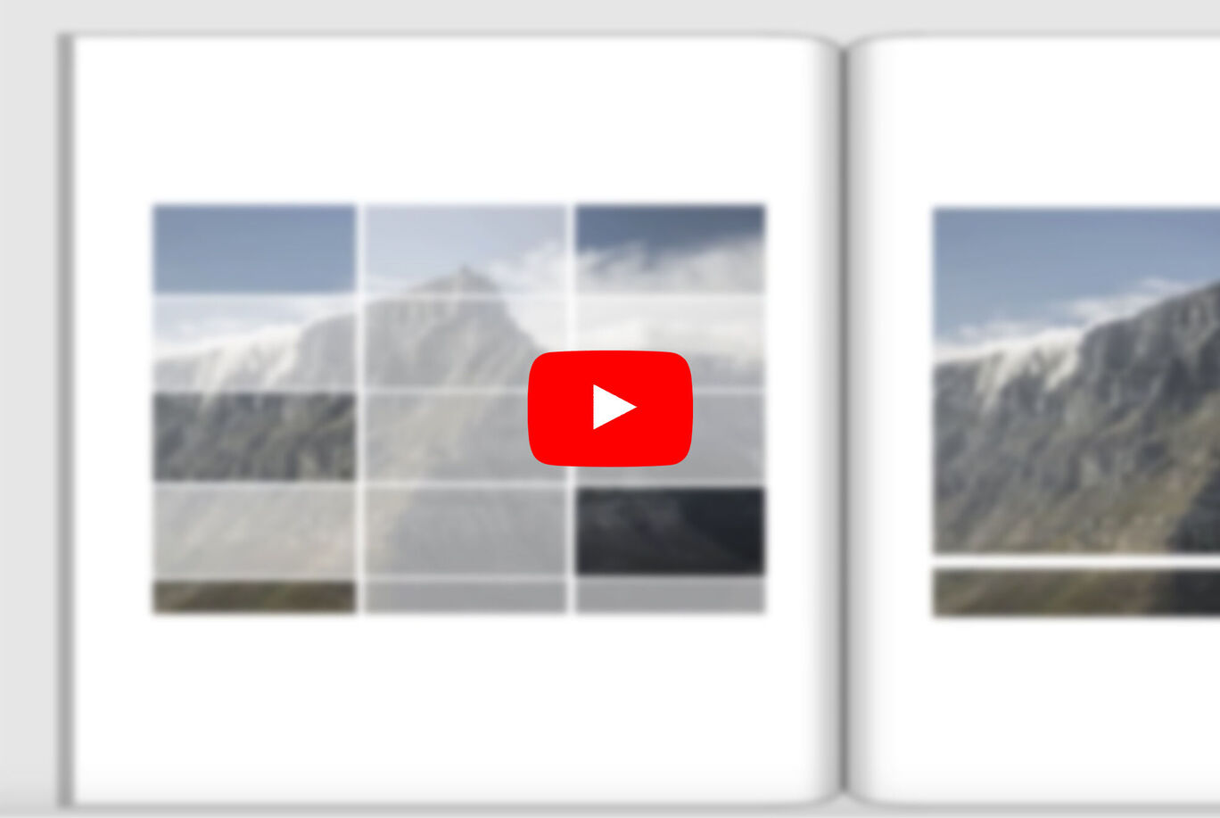 Un livre photo ouvert avec une vue des montagnes et un symbole Youtube au centre.