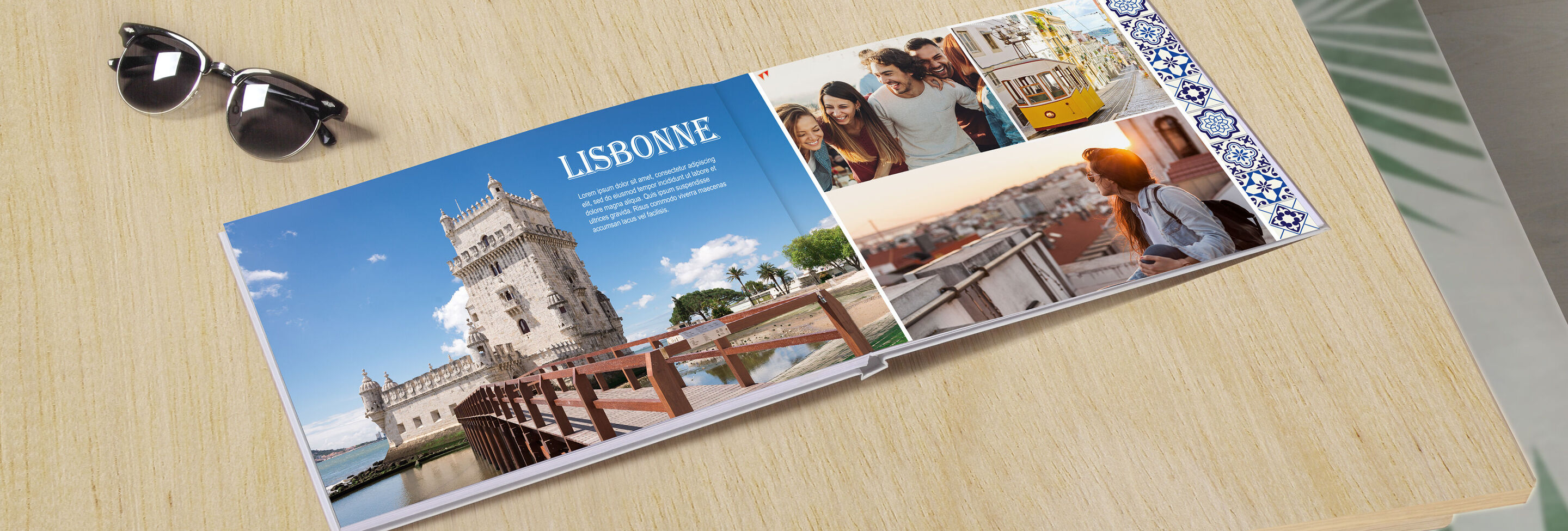 Un livre photo ouvert sur une table avec des images de Lisbonne, y compris la tour de Belém.